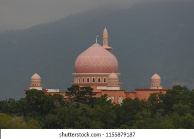 Remote View Of The Mosque Of Universiti Malaysia Sabah (UMS) In Kota Kinabalu, Sabah With Its Red Cupola.