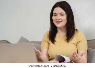 Remote Work and Digital Interaction. A professional woman expresses her ideas during an online meeting with enthusiasm.