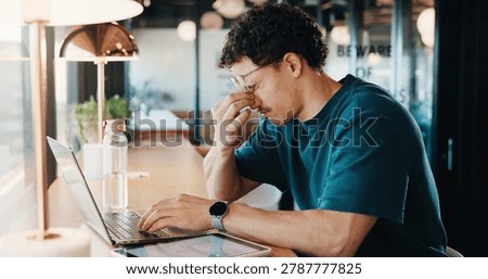 Remote work, eye strain and man in cafe with glasses, burnout or pressure with headache. Tired, migraine pain and freelancer in bistro with laptop, vision discomfort or sore head with dizziness.
