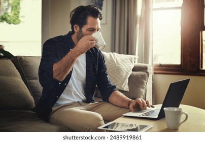 Remote work, man or laptop in home drinking coffee, blog post or company review on internet. Male person, small business or technology in living room for contact, ecommerce or online feedback on sofa - Powered by Shutterstock