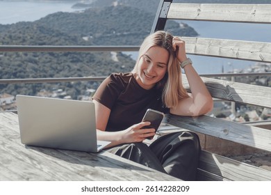 Remote Work,digital nomad enjoys remote work with a laptop in a scenic mountain setting.freedom of location-independent work, online business, and the balance of work and travel.