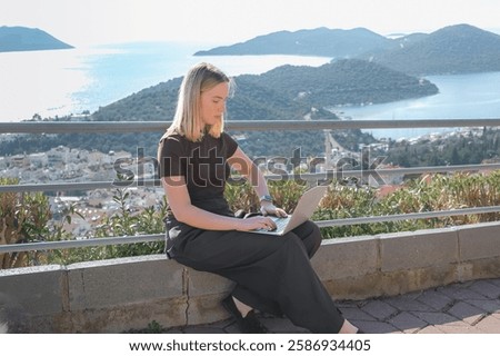 Remote Work,digital nomad enjoys remote work with a laptop in a scenic mountain setting.freedom of location-independent work, online business, and the balance of work and travel.