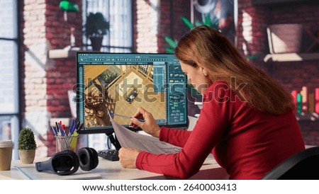 Remote worker in creative office uses CAD software and blueprints plan, design a house interior and provides a user interface for virtual home customization. Detailed architectural layout. Camera A.