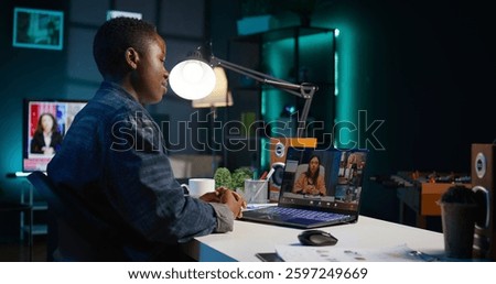 Remote worker talks with board of directors during videocall business meeting from home office. Teleworker speaks in remote videoconference telework call, receiving feedback from management, camera B