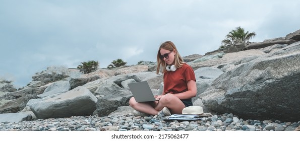 Remote Work.Girl Freelancer Works Remotely On The Seashore.workation, Remote Work,WFVH,Van Life Vibes Work From Vacation Home,work Travel,remotely Work.Travelling