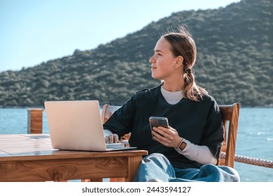 Remotely work.freelancer works remotely home.cozy workation, remote work,leisure, work balance,digital nomad,workation,work travel,remotely work.Travelling.Work vacation remotely,remotrly education - Powered by Shutterstock