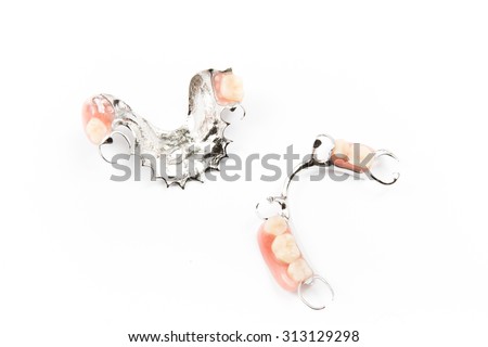 removable partial denture on white background.