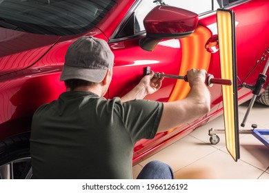 removal of dents without painting. PDR technology for car body repair