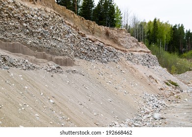 Removal of esker for use as natural resources. Deposits layed down in latest iceage by nature. Naturaly rounded stones and gravel. - Shutterstock ID 192668462