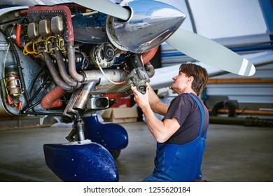 Removal And Repair Of An Engine Starter Of An Airplane By A Service Worker.