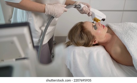 Removal Of Spider Veins With A Laser On The Face. Beauty Clinic: Laser Therapy. Professional Beautician Removes Spider Veins On Face Of Beautiful Client.