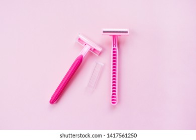 Removal Of Unwanted Hair, Concept. Disposable Shaving Machines For Women. Flat Lay Pink Background.