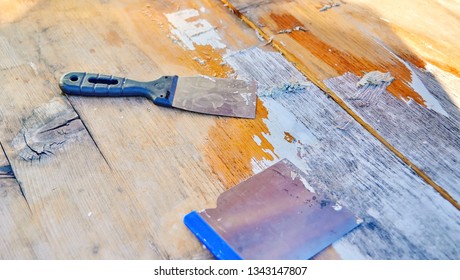 Remove Paint From Wooden Surface With Metal Scraper. Give Your Furniture A Whole New Look By Painting Your Old Stuff