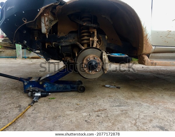 Removing 4x4 wheels when it's time
to replace parts in a car repair shop.remove car
wheel