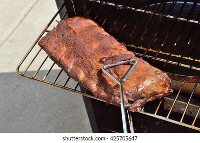 Removing Baby Back Ribs (Pork) From An Electric Barbecue Smoker