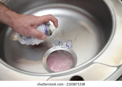 Removing Glue Of The Sticker With Liquid Wrench Oil Spray From The Surface Of The New Metal Kitchen Sink