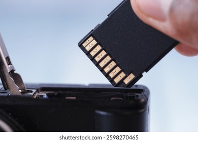 Removing memory card from a digital camera for data transfer