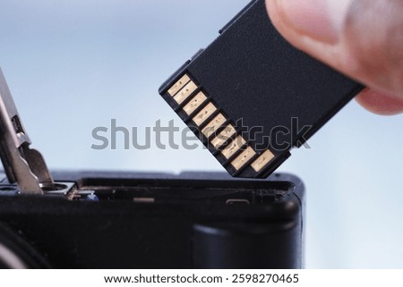 Removing memory card from a digital camera for data transfer