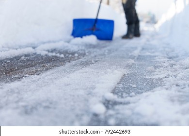 Removing Snow And Ice From The Sidewalk