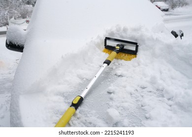 Removing Snow On The Car Window After Snow Storm     