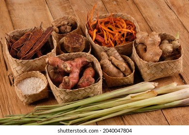 rempah-rempah, spices, ginger, lemongrass, galangal, secang wood, turmeric, tamarind, rice, palm sugar, kencur as ingredients for herbal medicine of the archipelago. Indonesian Spices. rustic table. 