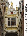 Renaissance Guilded gate, part of Aaron Civil Registry date 1543, and an entrance to Burg Square, Square. Bruges, West Flanders, Belgium, Europe
