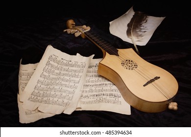 Renaissance lute (citole) with musical notes in retro style.