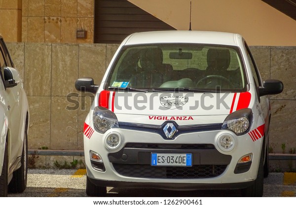 Renault car security service and patrol service\
parked on street in Rimini is town in Emilia-Romagna region of\
northern Italy and capital city of Province. Sunny summer day.\
Rimini, Italy, 2014.