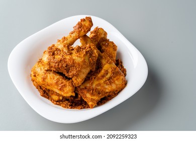Rendang Ayam or Chicken Rendang,  is an Indonesian food from West Sumatra in Indonesia. 
Chicken Rendang served on plate and isolated gray background.