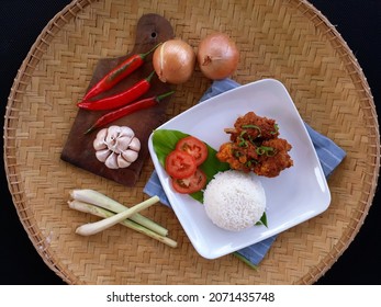 Rendang Ayam Or Chicken Rendang Served With Rice In Bamboo Tray. Rendang Ayam Is A Traditional Menu In Malaysia, A Chicken Cooked With Delicacy  Various Spices And Its Delicious And Spicy. Top View.