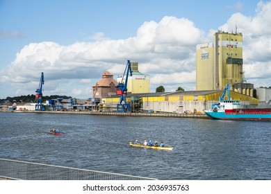 Rendsburg, Germany, Sept. 2021 Quay On The Kiel Canal In Rendsburg With An Animal Feed Store And Two Rowing Boats