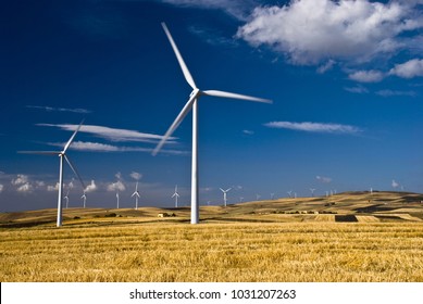 Renewable Energy And Environmental Impact. Countryside With Wind Generators