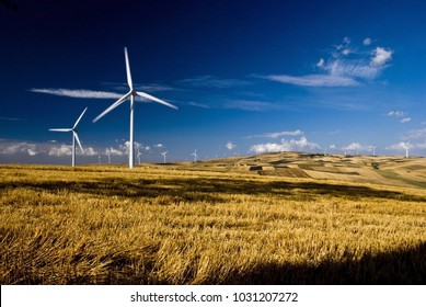 Renewable Energy And Environmental Impact. Countryside With Wind Generators