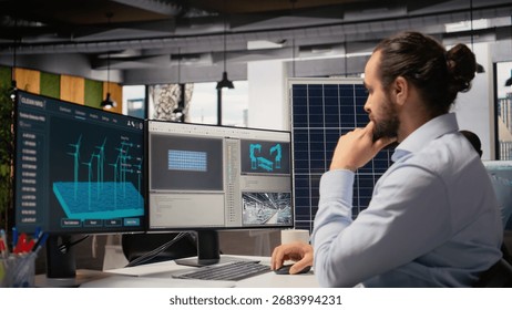 Renewable energy researcher using simulation software to automate solar panels assembly and wind turbines farm infrastructure, improving green industry efficiency, camera A