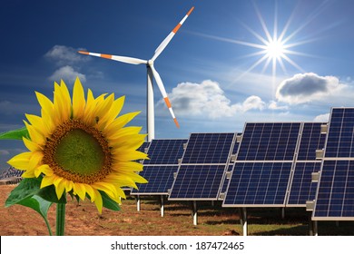 renewable energy: windmill, solar panel and sunflower - Shutterstock ID 187472465