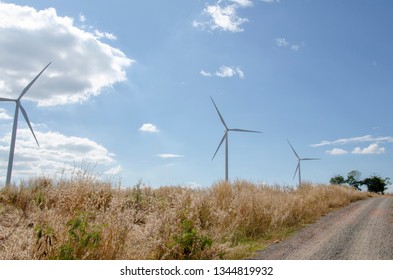 Renewable wind turbines with sky pattern background with white clouds