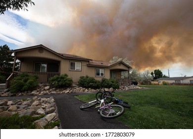 Reno, Nevada / USA - June 27 2020: Bikes Left Outside After A Family Evacuates Their Neighborhood Due To The Poeville Fire In Reno, Nevada. 