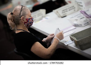 Reno, Nevada / USA - June 9 2020: Election poll workers wear masks during the 2020 primary election day in Nevada. 