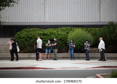 Reno, Nevada / USA - June 9 2020: Voters And Campaign Staff Wear Masks During The 2020 Primary Election Day In Nevada.