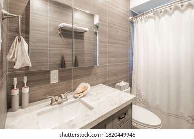 Renoed Bathroom With Tooth Brushes On The Counter