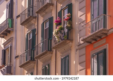 Renovated Facade of the Old Italian House with Balcony Decorated with Fresh Flowers - Shutterstock ID 1979242187