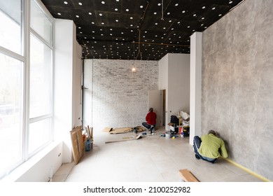 renovated room with shopping window - empty store shop with wooden floor and white walls - Shutterstock ID 2100252982