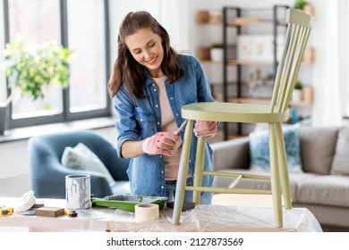 Renovation, Diy And Home Improvement Concept - Happy Smiling Woman In Gloves With Paint Brush Painting Old Wooden Chair In Grey Color