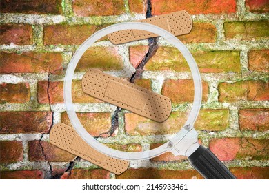 Renovation of an old cracked brick wall - concept with bandaid patch seen through a magnifying glass