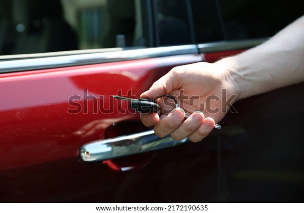 Rent Car Manager is giving  keys of rent vehicle\
to the client