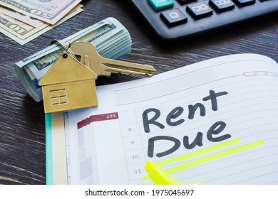 Rent Due Sign In The Planner And Key.