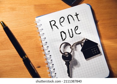 Rent Due Text On Notepad With House Key 