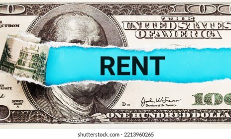 Rent Word Written On With American Dollar-bills. The Word Rent On Dollar Usa Background.The Concept Of Renting Housing And Real Estate. The Cost Of A Rented Home Or Apartment. Saving Money. Rental.