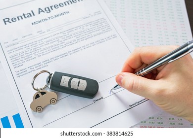 Rental Agreement For A Car With Contract, Pen And Keys