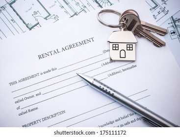 Rental Agreement Document With Keys And Pencil